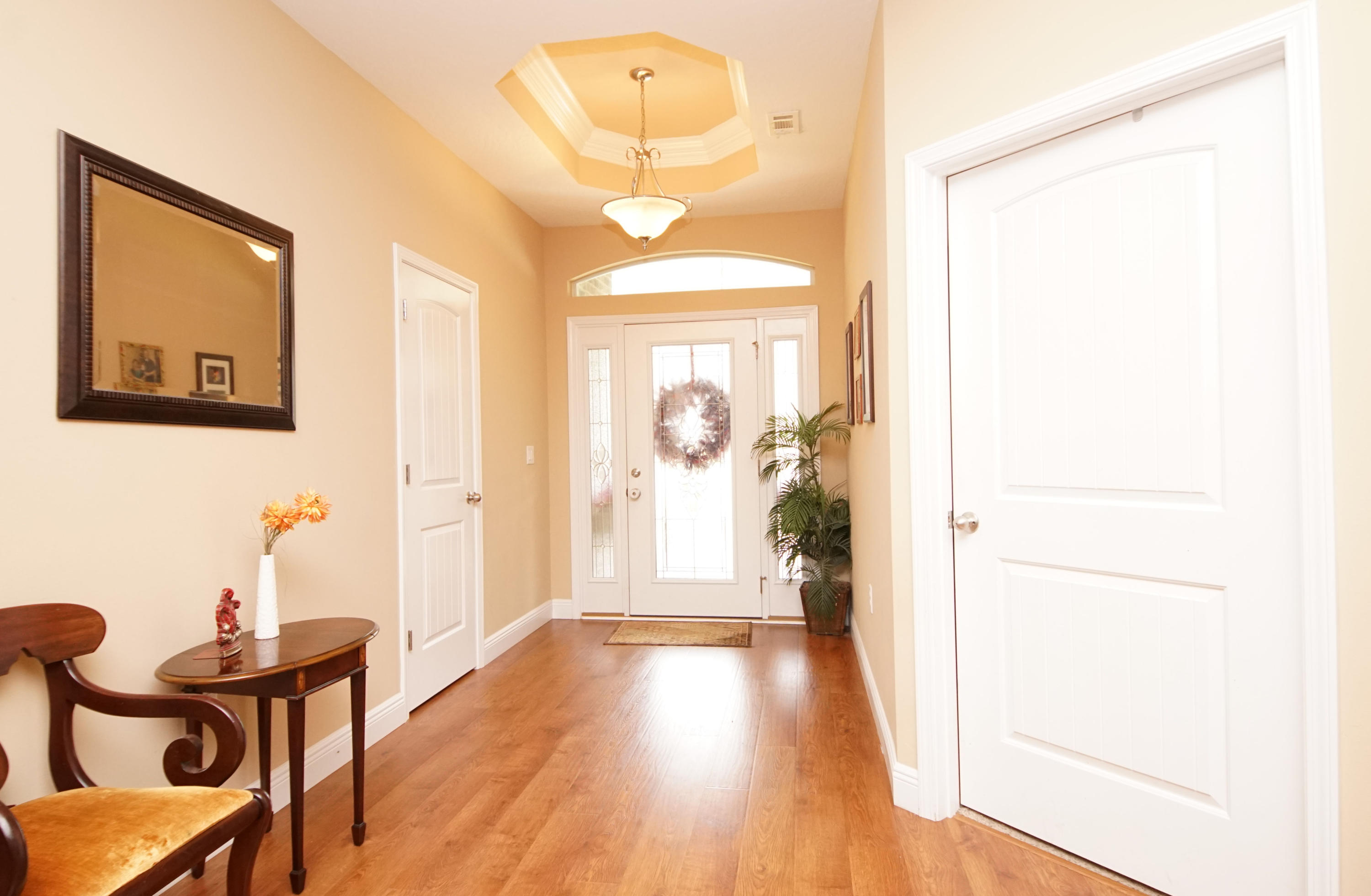 616 Lang Road Fort Walton Beach, FL 32547 - Photo 29 of 54 a view of a hallway with wooden floor and a bathroom