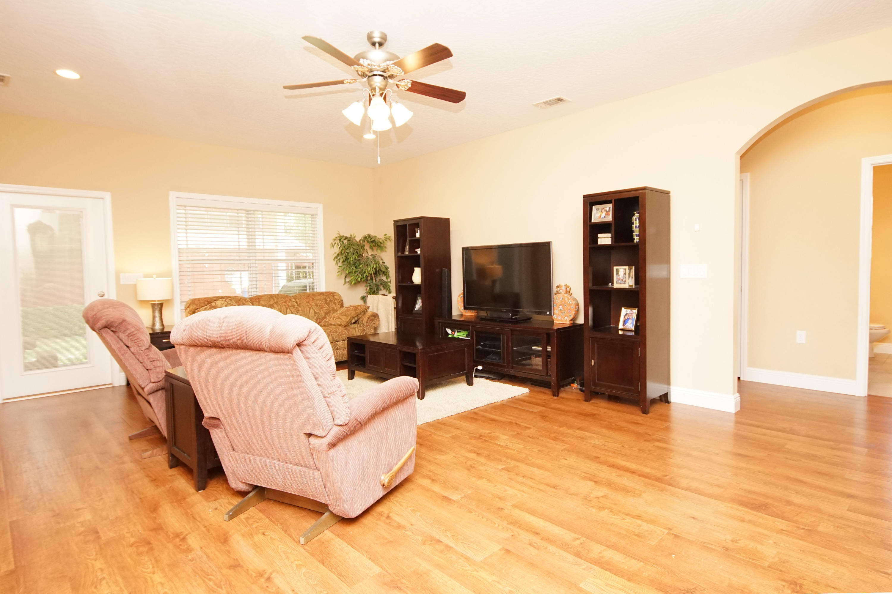 616 Lang Road Fort Walton Beach, FL 32547 - Photo 3 of 54 a living room with furniture and a flat screen tv
