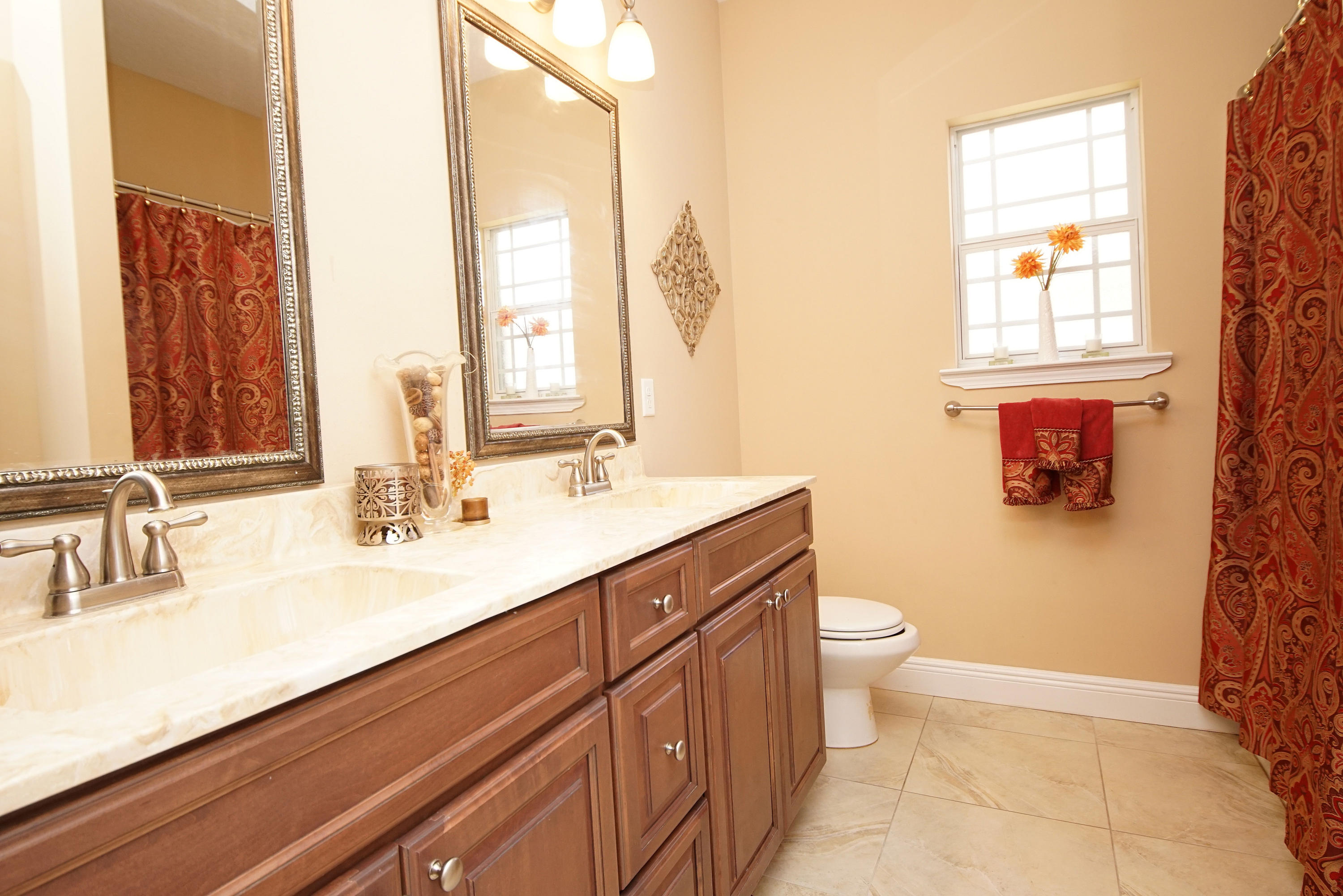 616 Lang Road Fort Walton Beach, FL 32547 - Photo 34 of 54 a bathroom with a double vanity sink toilet and a mirror