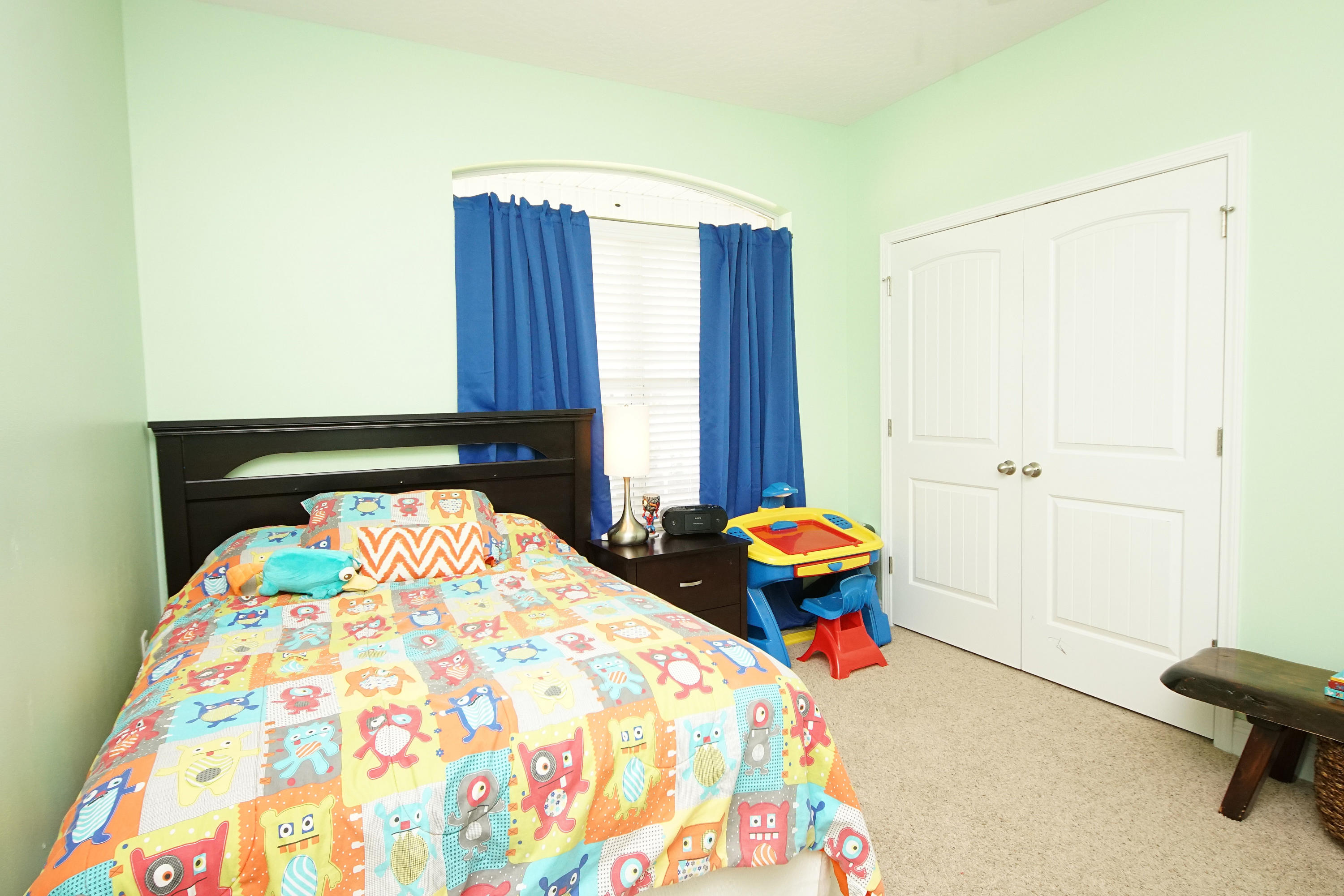 616 Lang Road Fort Walton Beach, FL 32547 - Photo 36 of 54 a bedroom with a bed and wooden floor