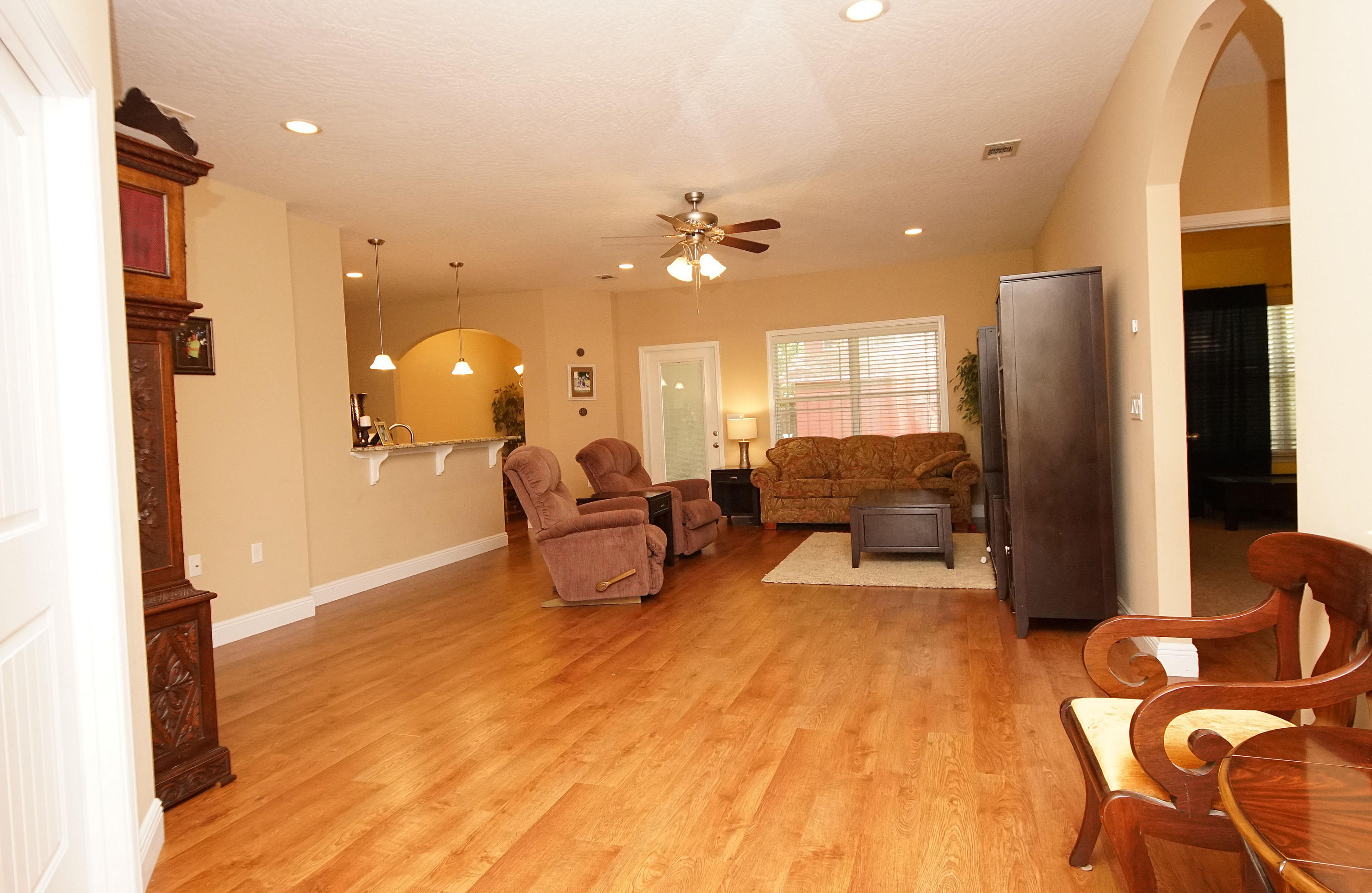 616 Lang Road Fort Walton Beach, FL 32547 - Photo 4 of 54 a living room with furniture and a chandelier