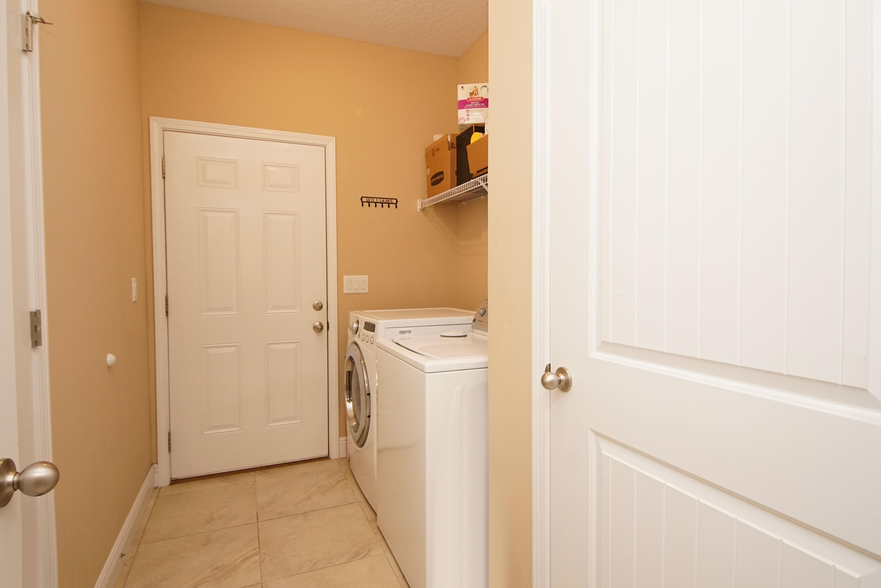 616 Lang Road Fort Walton Beach, FL 32547 - Photo 42 of 54 a view of a storage & utility room with a washer dryer
