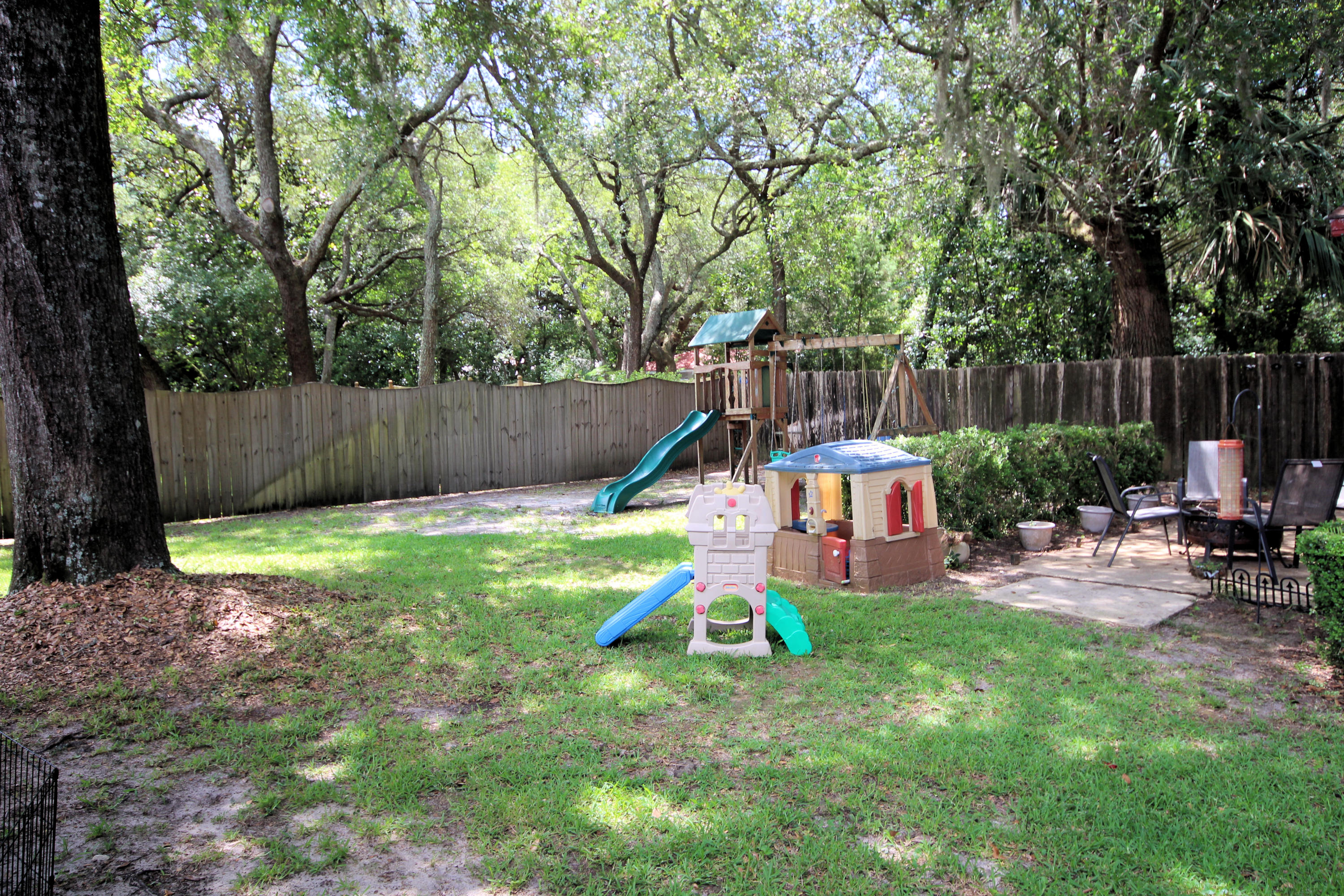 616 Lang Road Fort Walton Beach, FL 32547 - Photo 44 of 54 a view of playground with a slide trees and wooden fence
