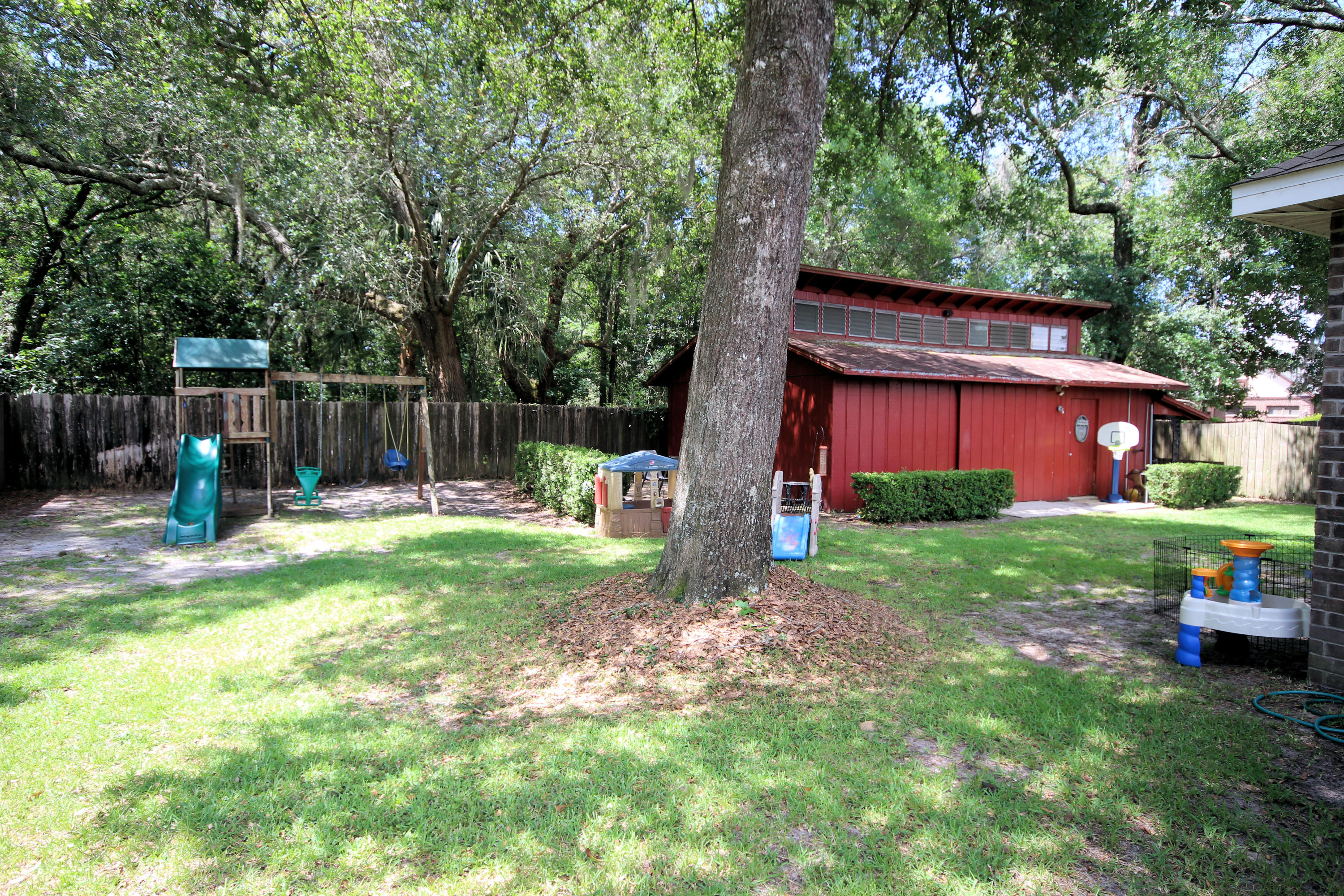 616 Lang Road Fort Walton Beach, FL 32547 - Photo 45 of 54 a view of a house with backyard and a tree