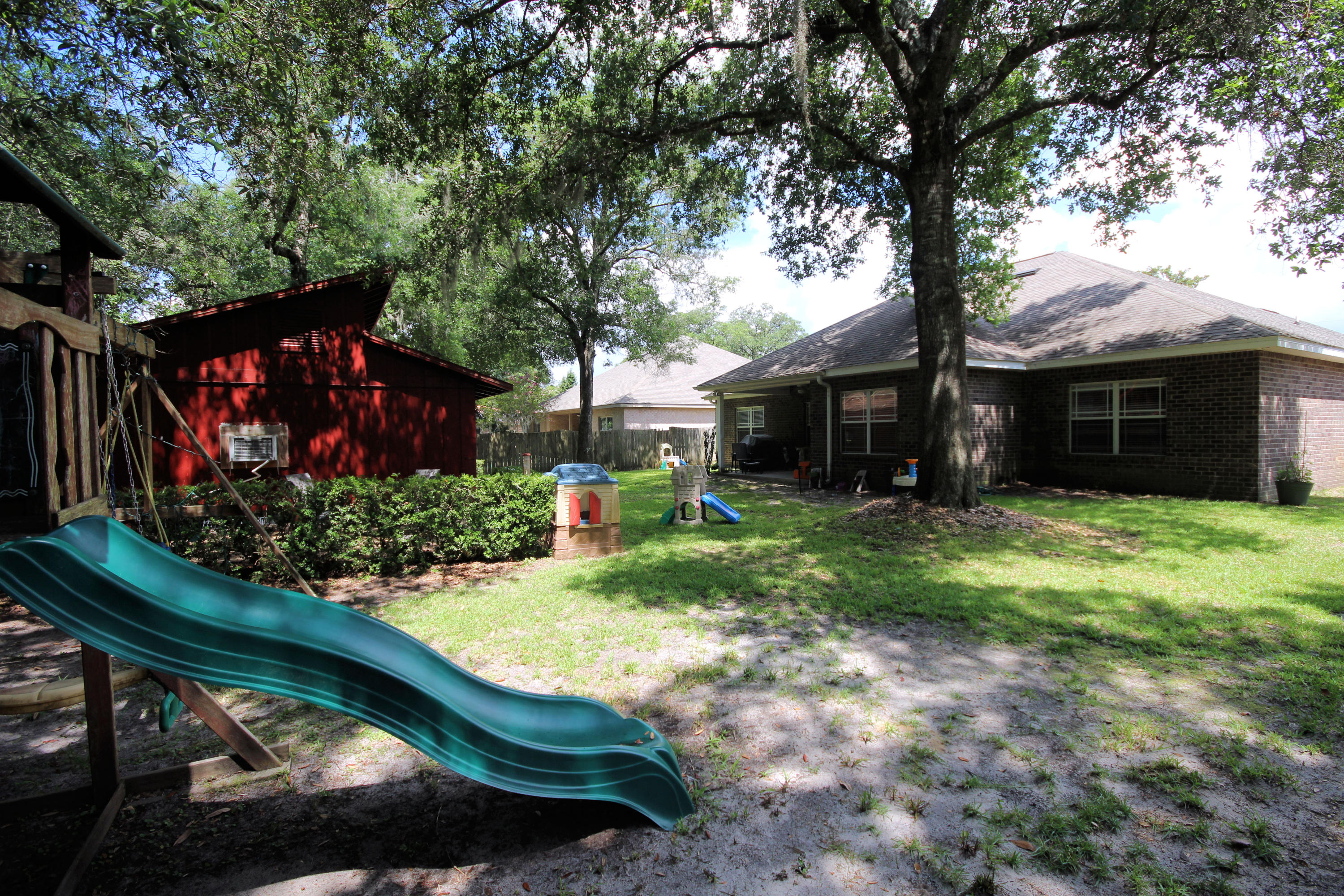 616 Lang Road Fort Walton Beach, FL 32547 - Photo 47 of 54 a front view of house with a garden