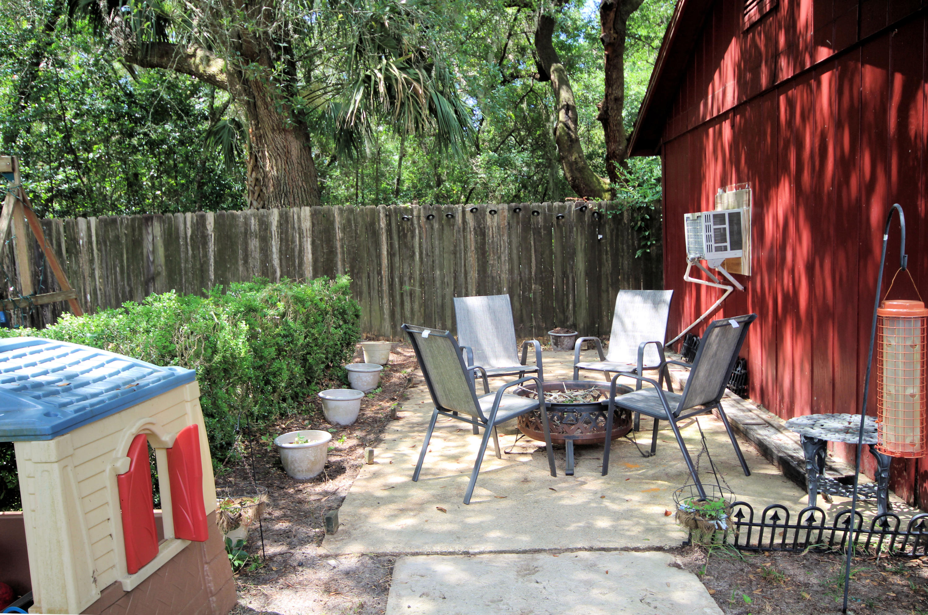616 Lang Road Fort Walton Beach, FL 32547 - Photo 49 of 54 a view of outdoor dining space with a patio and a garden