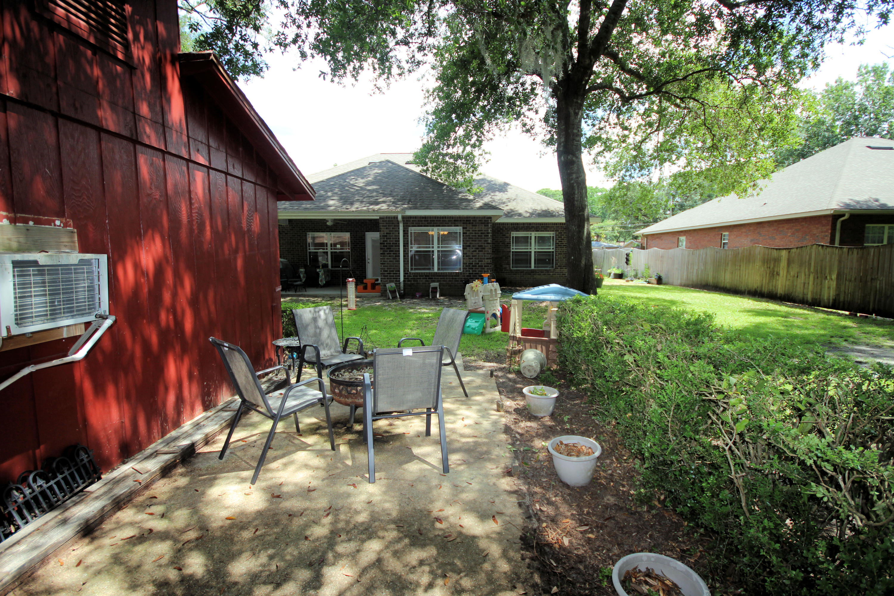 616 Lang Road Fort Walton Beach, FL 32547 - Photo 50 of 54 a view of backyard of house with seating space
