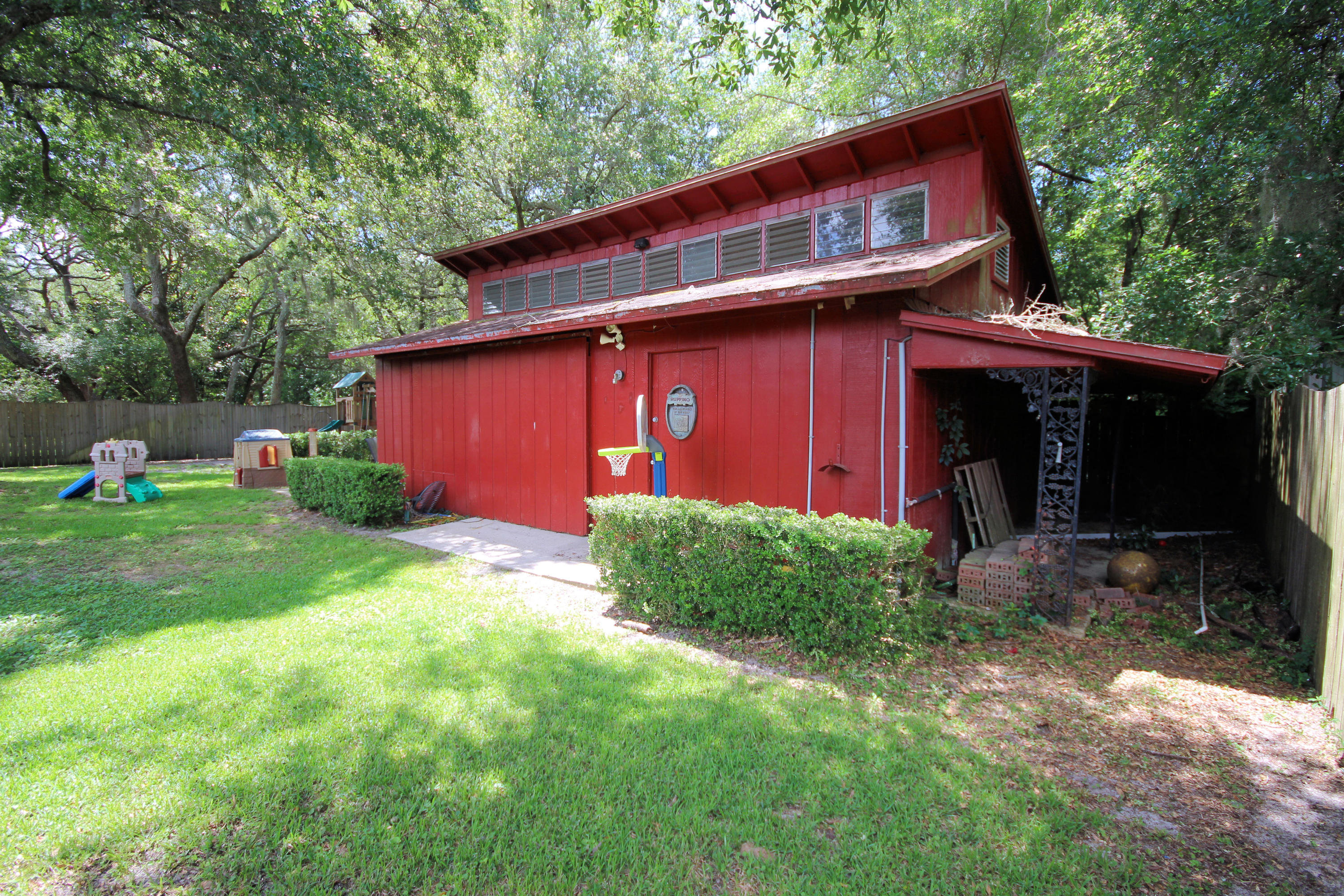 616 Lang Road Fort Walton Beach, FL 32547 - Photo 51 of 54 a view of a barn in the middle of a yard