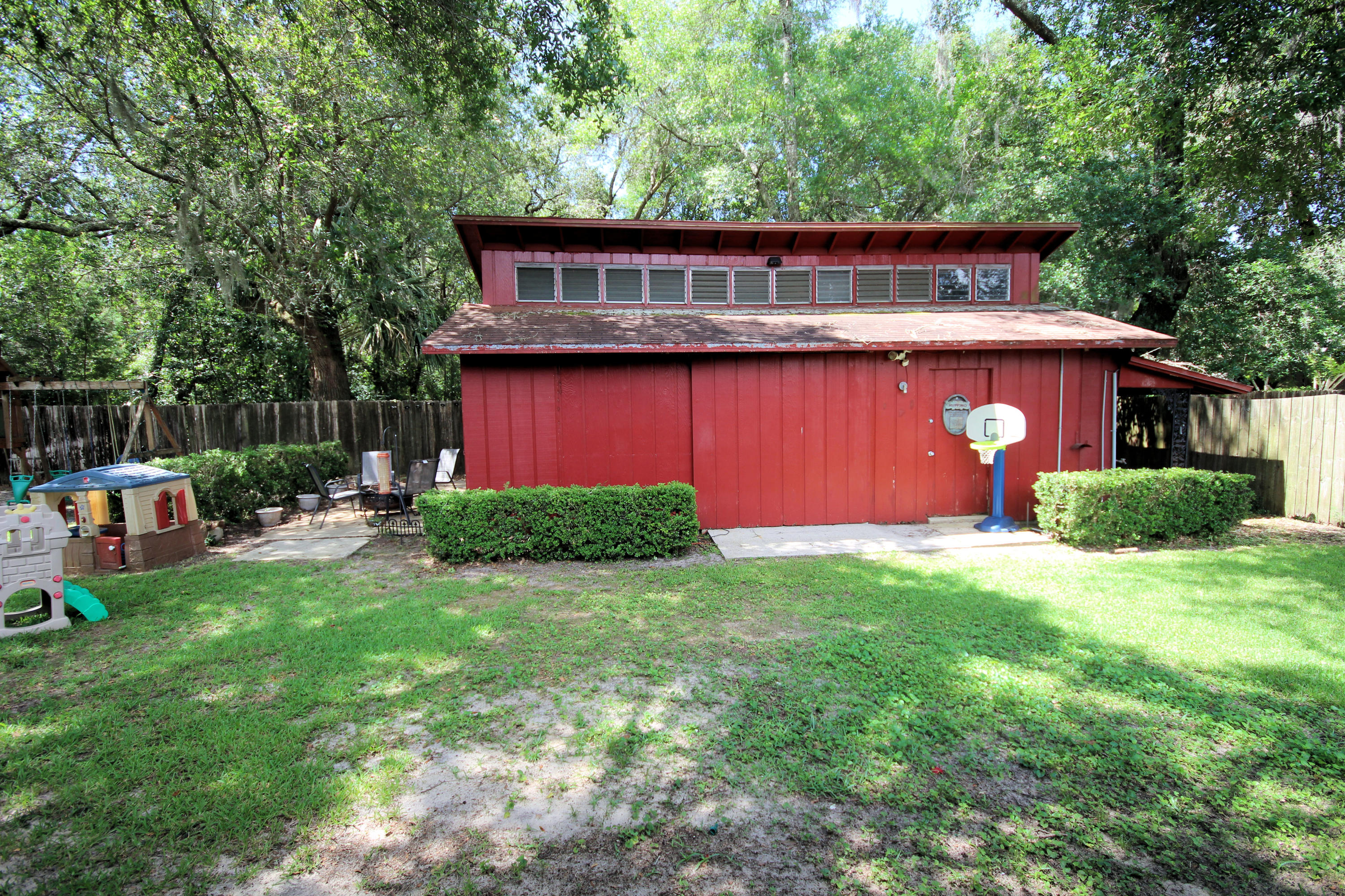 616 Lang Road Fort Walton Beach, FL 32547 - Photo 52 of 54 a view of a house with backyard and sitting area