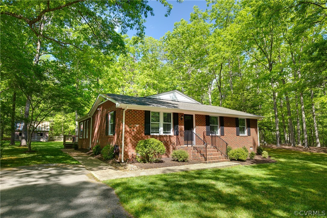 2320 Moseley Road Moseley, VA 23120 - Photo 1 of 48 a front view of house with yard and green space
