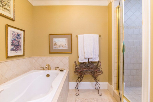 54 Cedar Ridge Court Macon, GA 31210 - Photo 14 of 24 a bathroom with a tub and a shower