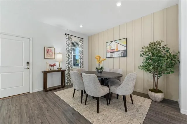 a view of a livingroom with furniture and a potted plant