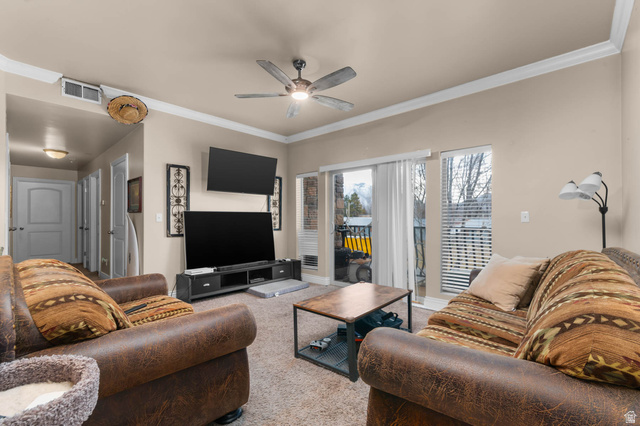 476 West 200 N Street, Unit 206 Springville, UT 84663 - Photo 3 of 24 Living room with crown molding, ceiling fan, and carpet flooring