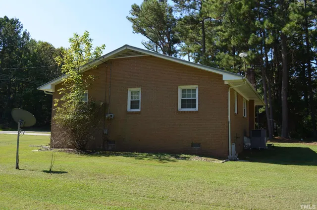 a house with trees in the background
