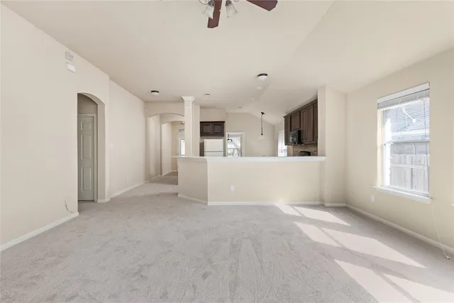 a view of a kitchen with furniture and windows