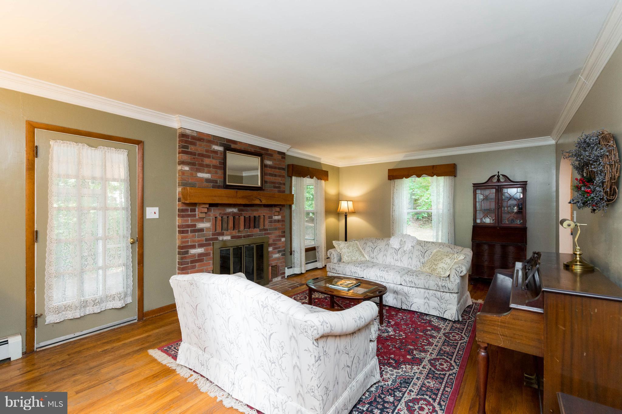 2704 Carrollton Road Finksburg, MD 21048 - Photo 5 of 30 Cozy Living Room with Wood-Burning Fireplace