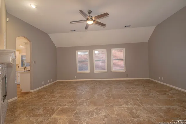 a view of an empty room with a window