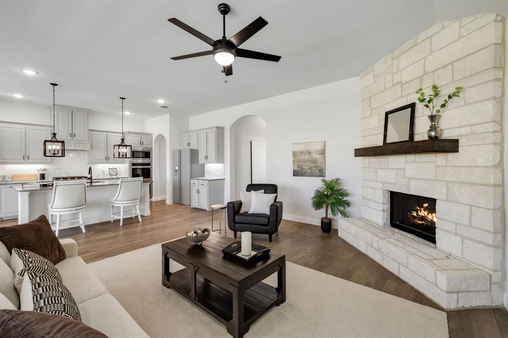 a living room with furniture and a fireplace