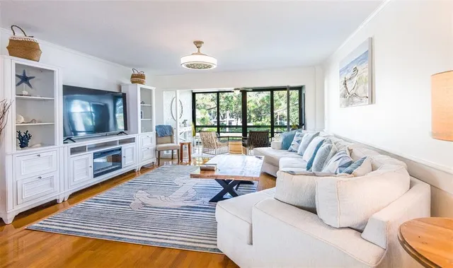 a living room with furniture and a flat screen tv
