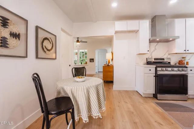 a kitchen with a stove and a refrigerator