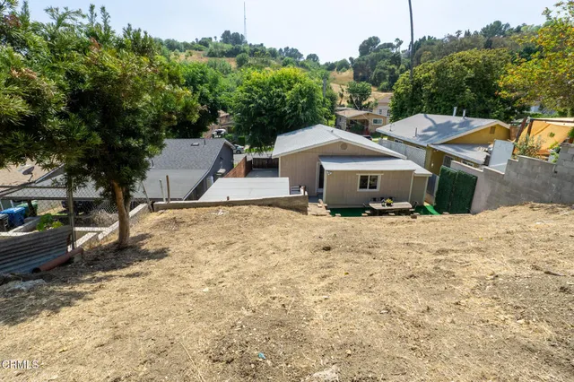 a house with trees in the background