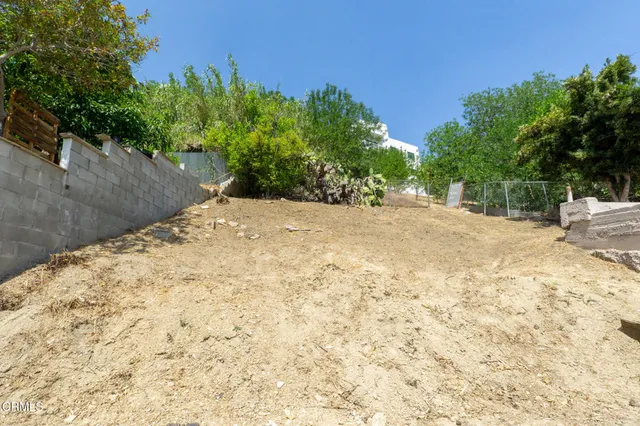 a view of a backyard of a house