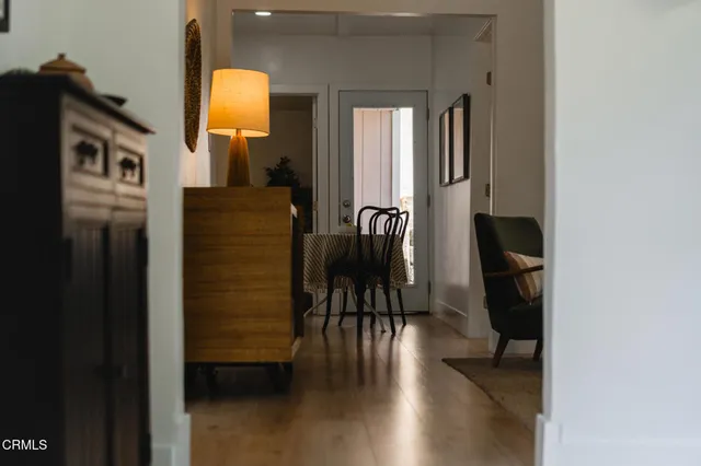 wooden floor in a livingroom and a bathroom