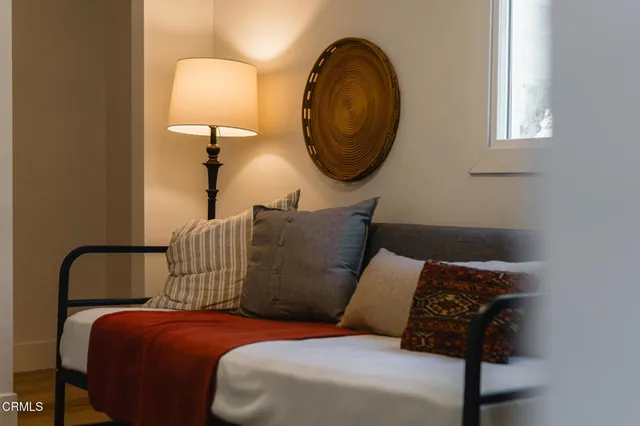 a bed room with a bed and a chair