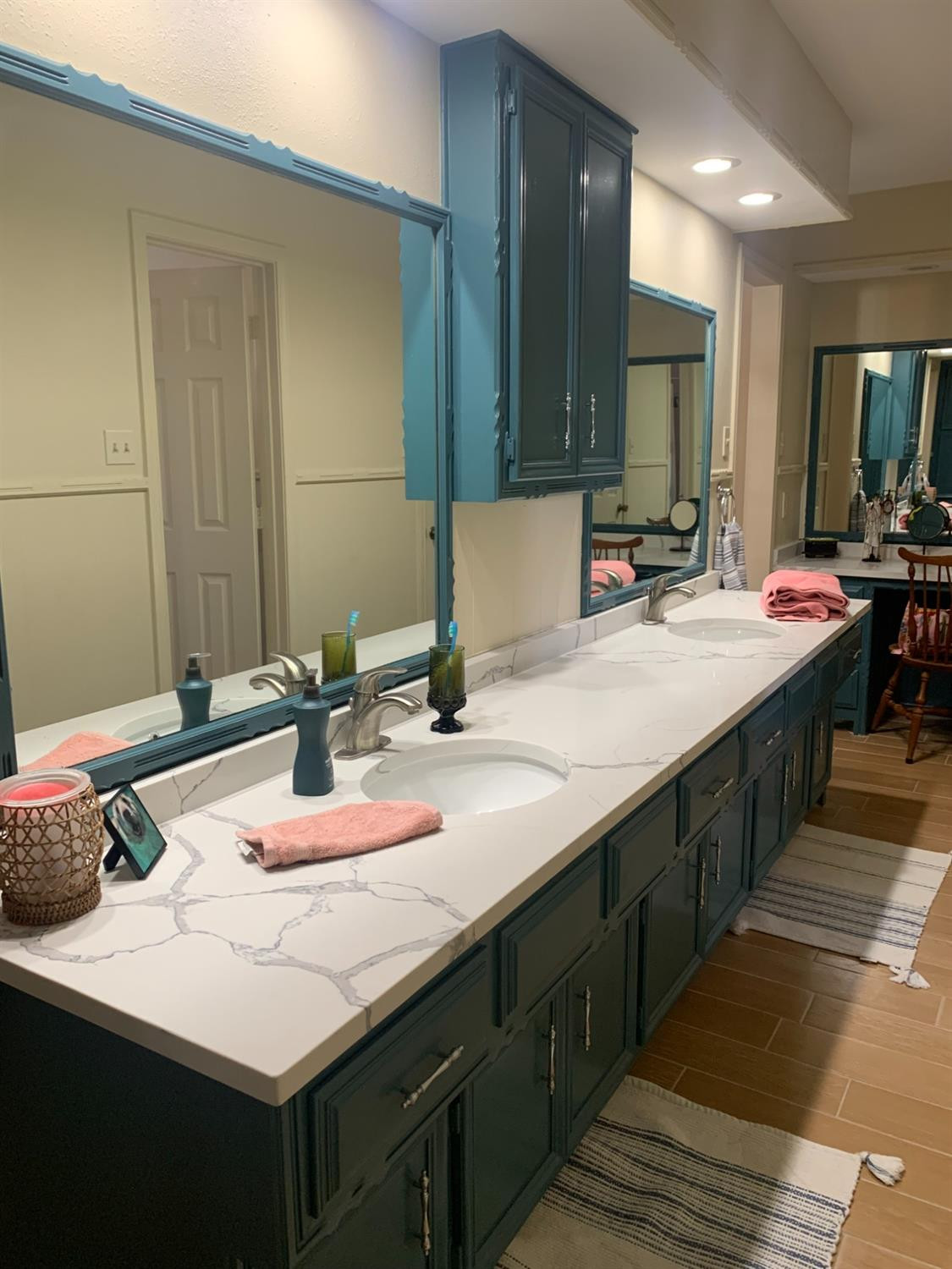 5726 70th Street Lubbock, TX 79424 - Photo 17 of 24 a bathroom with a sink double vanity and a mirror
