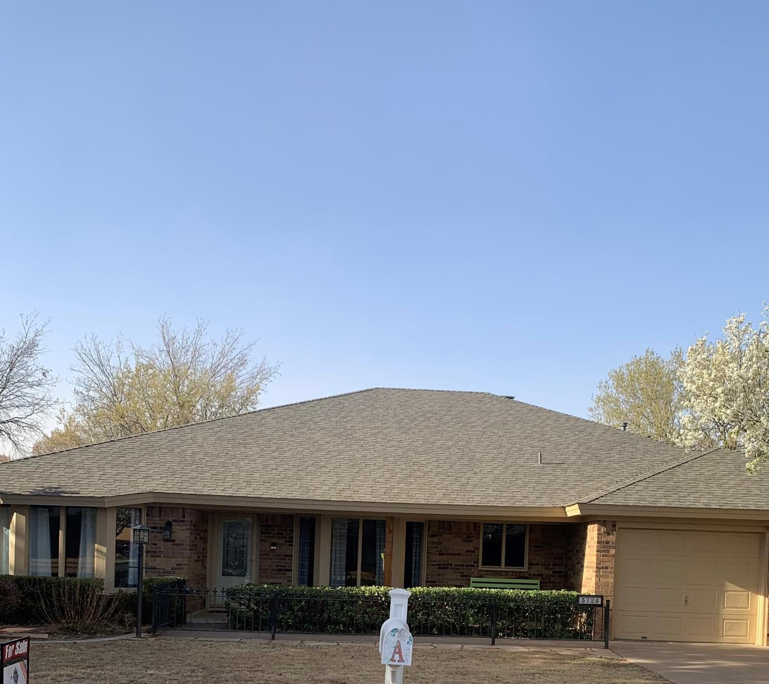 5726 70th Street Lubbock, TX 79424 - Photo 2 of 24 a front view of a house with a yard
