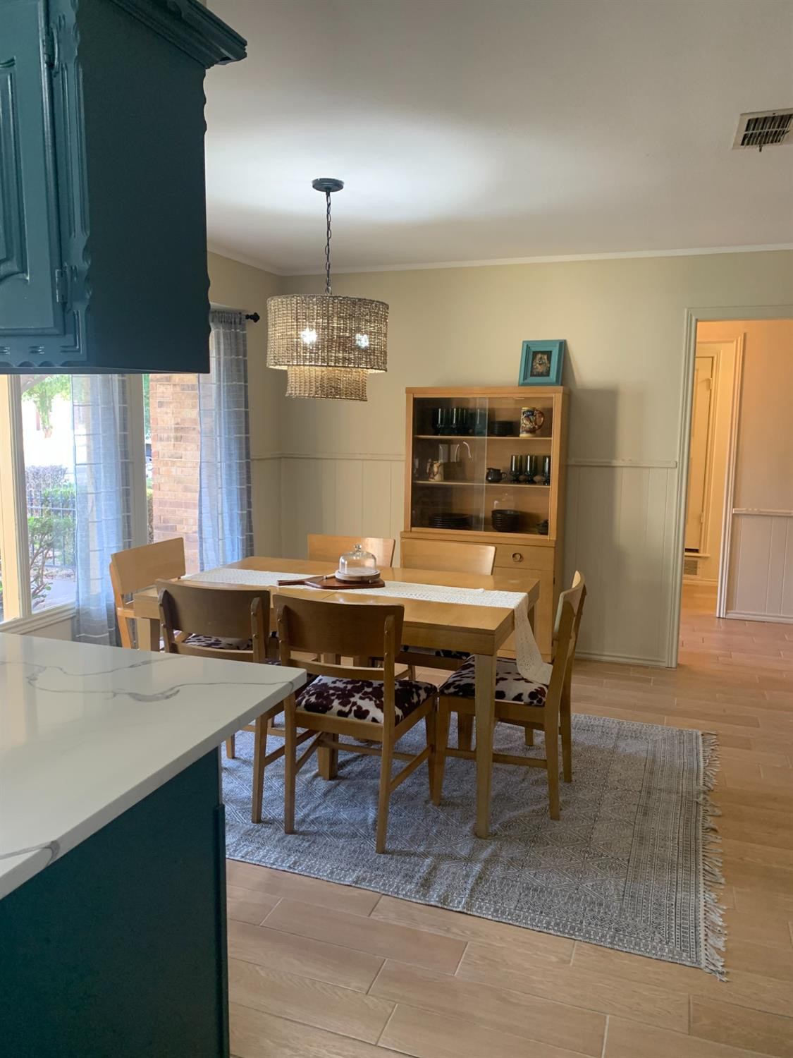 5726 70th Street Lubbock, TX 79424 - Photo 21 of 24 a view of a dining room with furniture and window