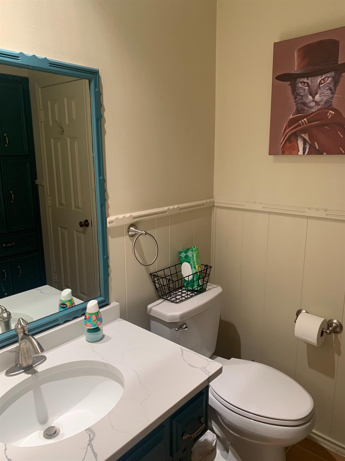 5726 70th Street Lubbock, TX 79424 - Photo 10 of 24 a bathroom with a sink a toilet and a mirror