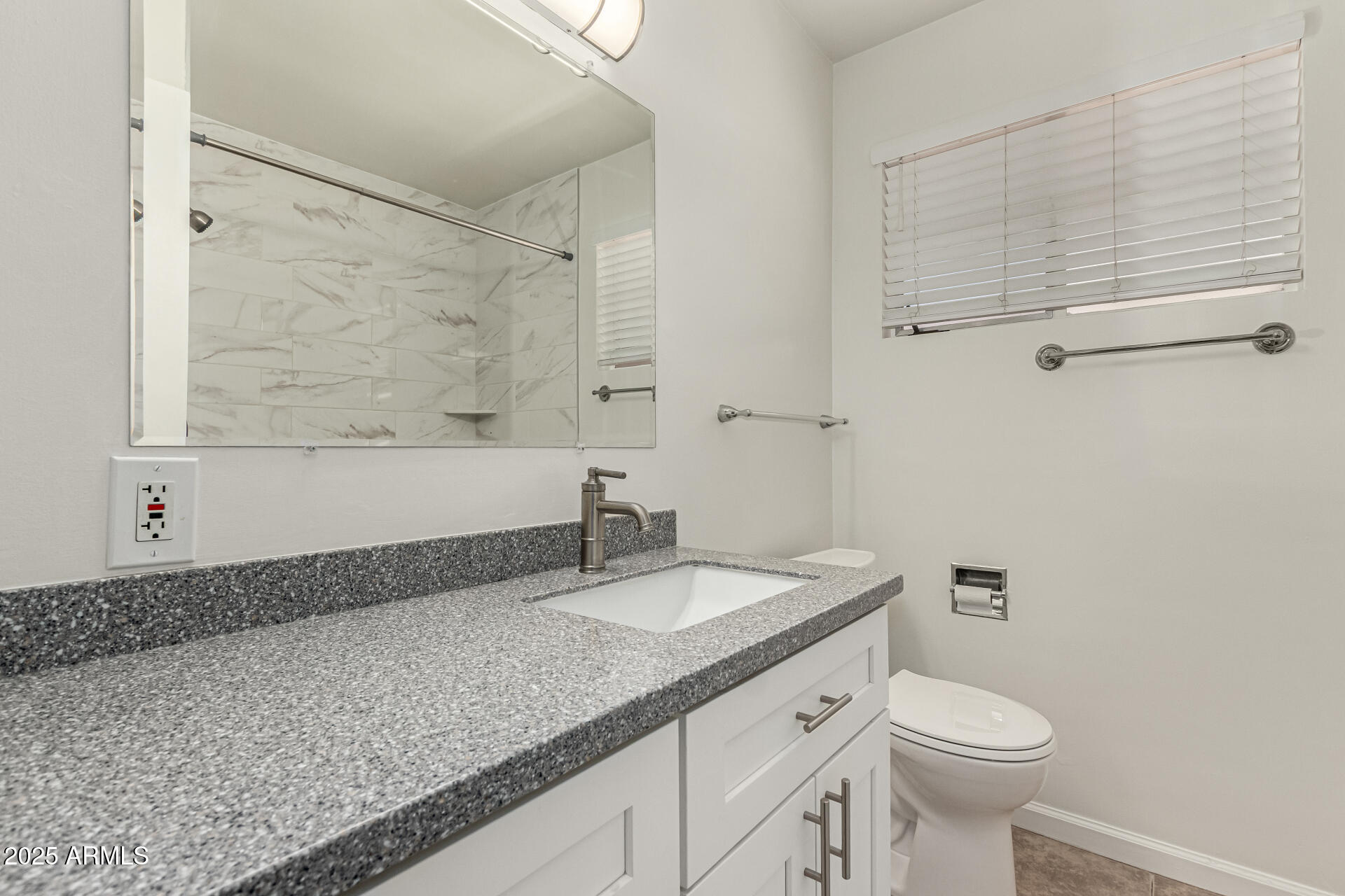 3540 East Montecito Avenue, Unit 3 Phoenix, AZ 85018 - Photo 17 of 23 a bathroom with a granite countertop sink a toilet and a bathtub