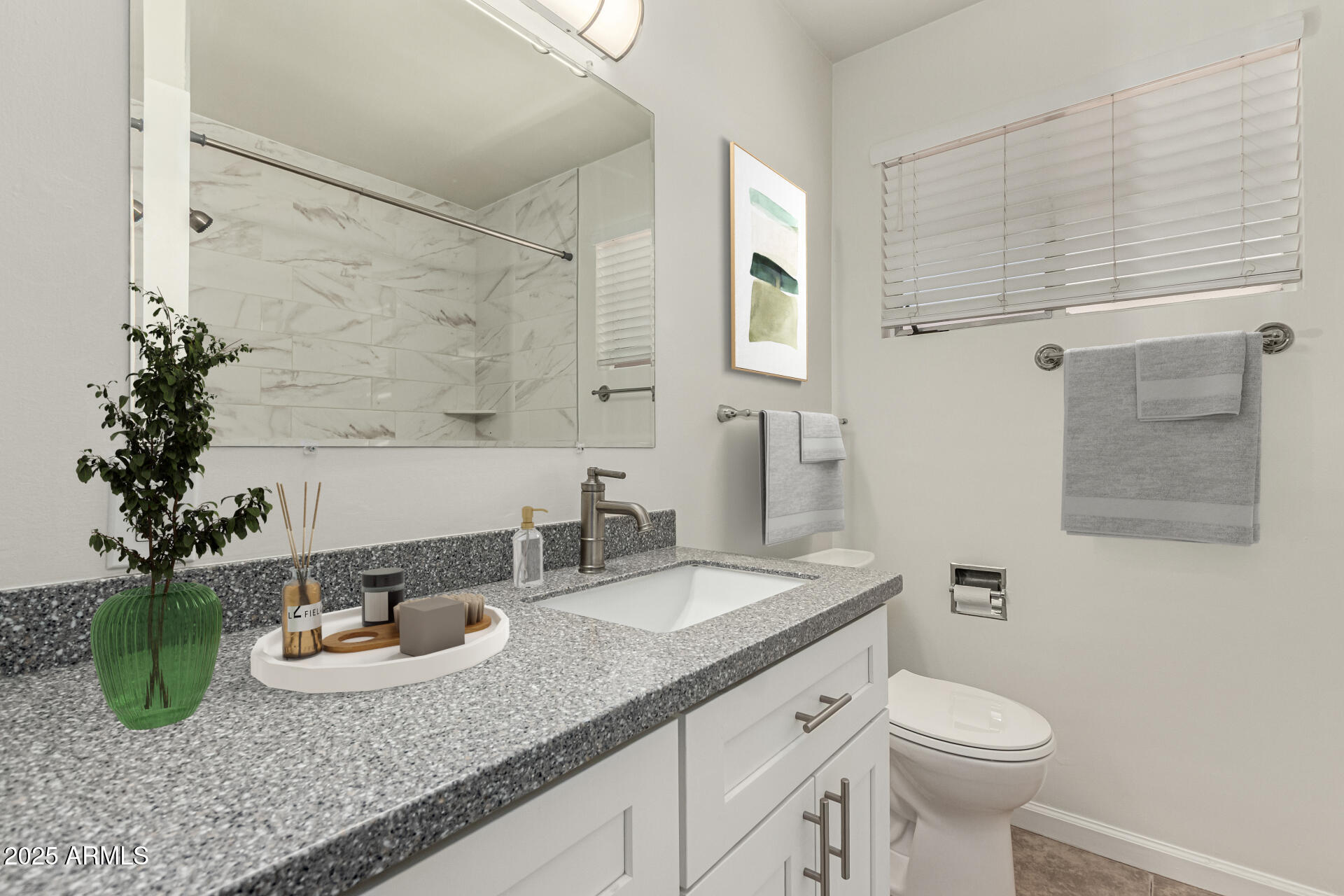 3540 East Montecito Avenue, Unit 3 Phoenix, AZ 85018 - Photo 18 of 23 a bathroom with a granite countertop sink a toilet and mirror