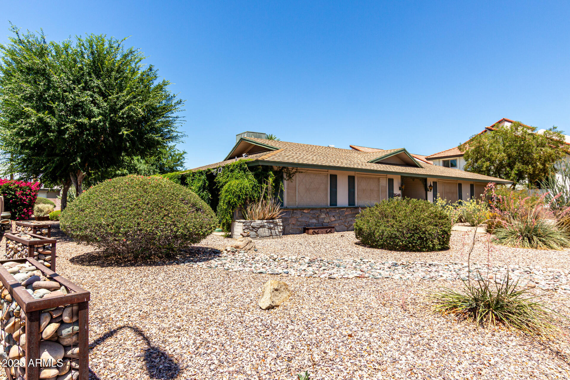 3540 East Montecito Avenue, Unit 3 Phoenix, AZ 85018 - Photo 2 of 23 a view of a house with a yard