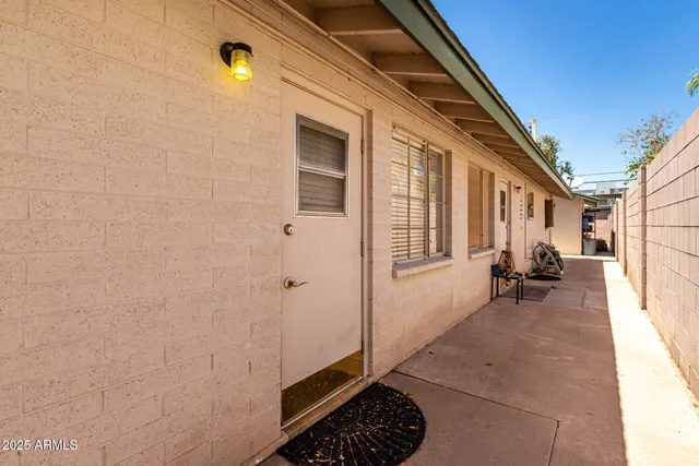 a view of a house with backyard and a window