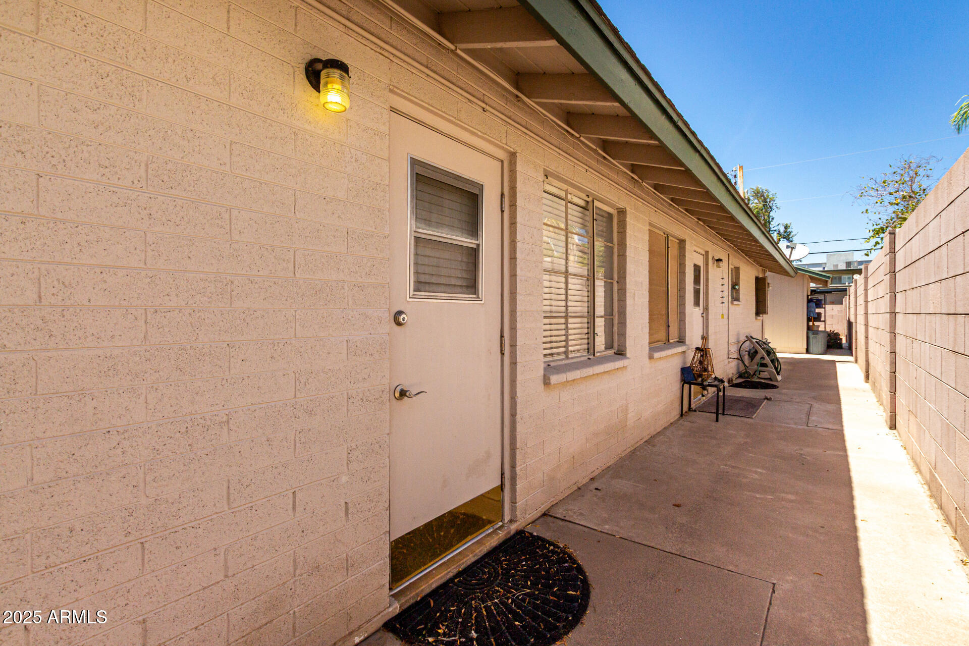 3540 East Montecito Avenue, Unit 3 Phoenix, AZ 85018 - Photo 21 of 23 a backyard of a house with outdoor seating
