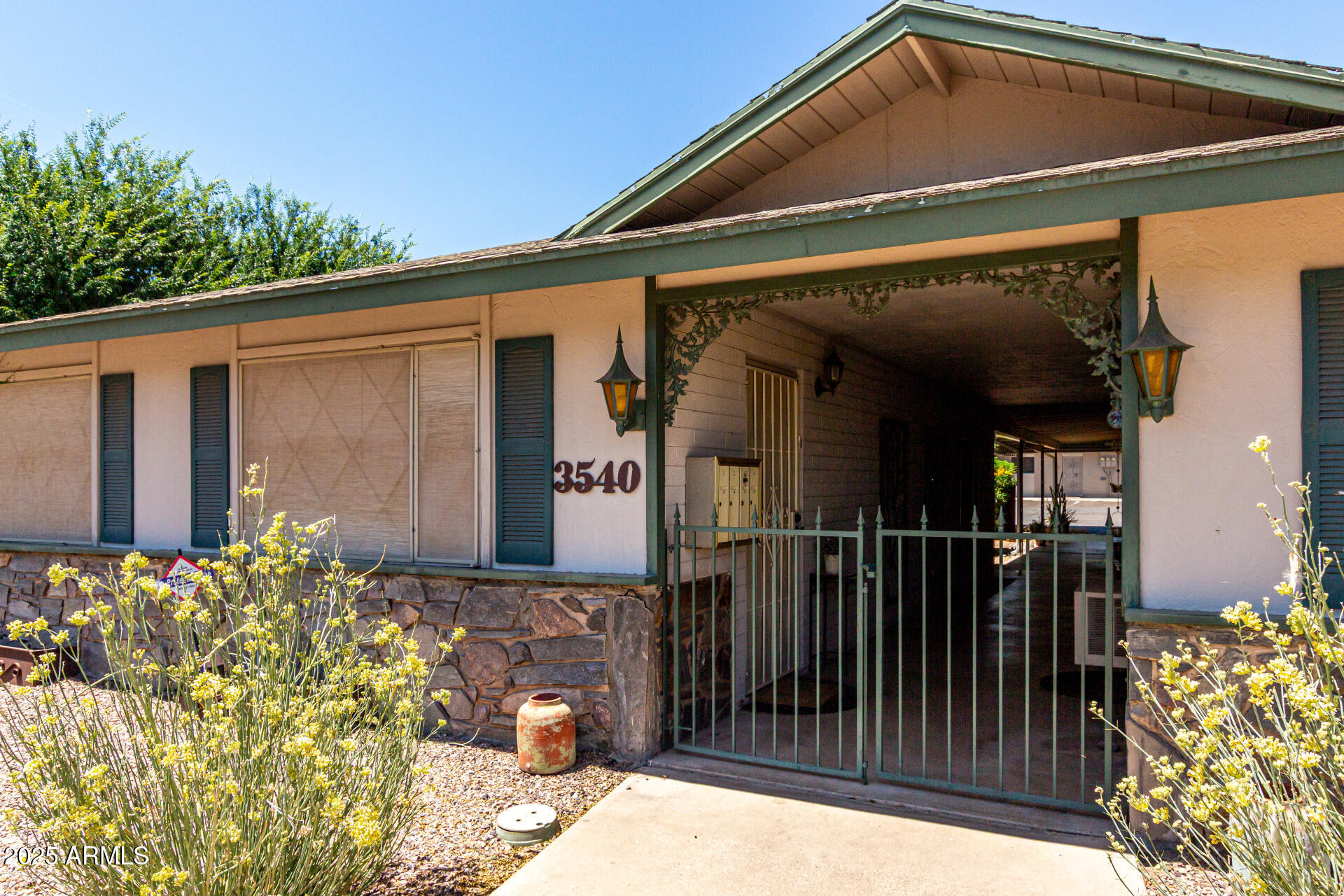 3540 East Montecito Avenue, Unit 3 Phoenix, AZ 85018 - Photo 3 of 23 a front view of a house
