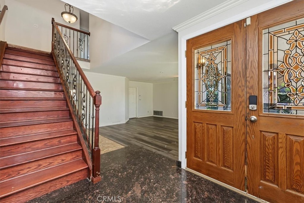908 West Mesa Drive Rialto, CA 92376 - Photo 13 of 20 a view of entryway and hall with wooden floor