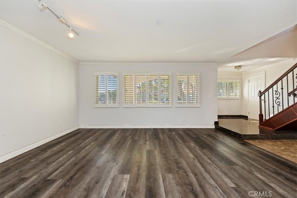 908 West Mesa Drive Rialto, CA 92376 - Photo 14 of 20 wooden floor in an empty room with a window