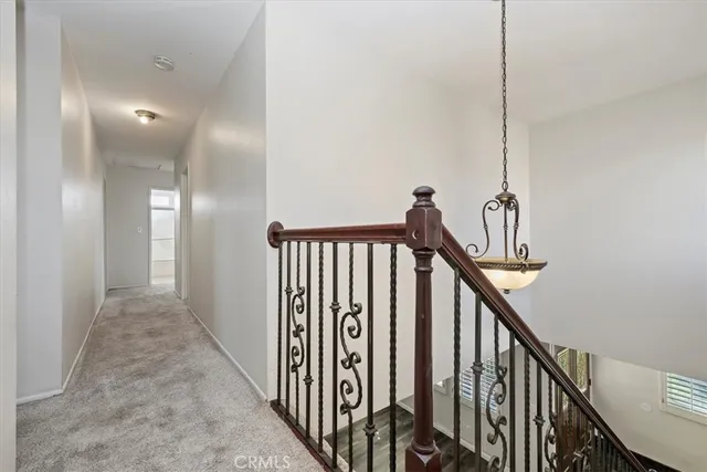 a view of a hallway with stairs