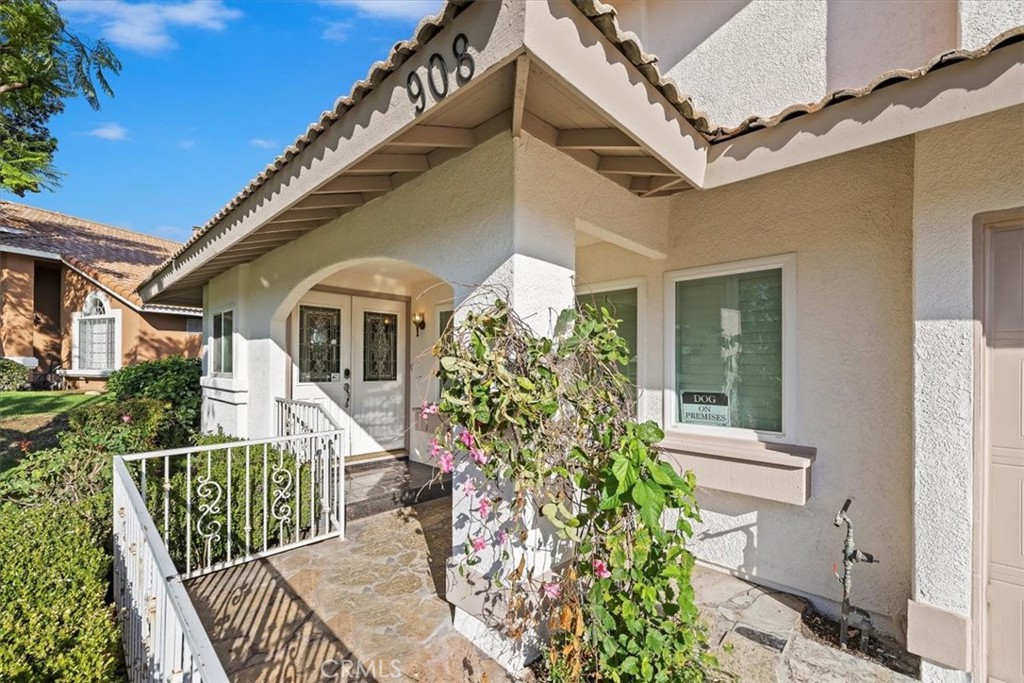 908 West Mesa Drive Rialto, CA 92376 - Photo 3 of 20 a front view of a house with garden