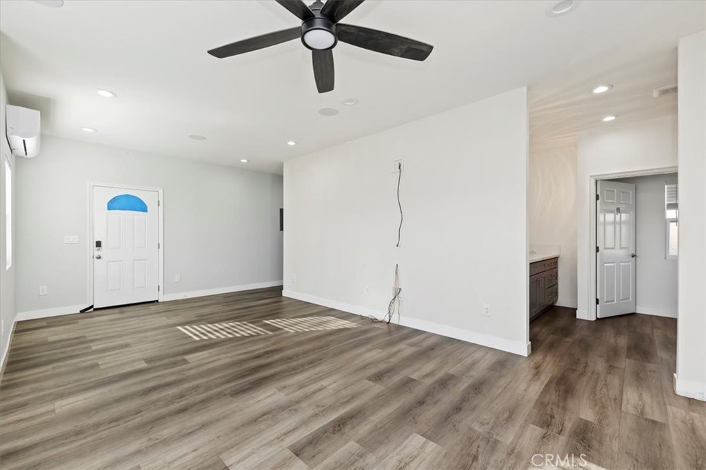 908 West Mesa Drive Rialto, CA 92376 - Photo 5 of 20 a view of an empty room with wooden floor