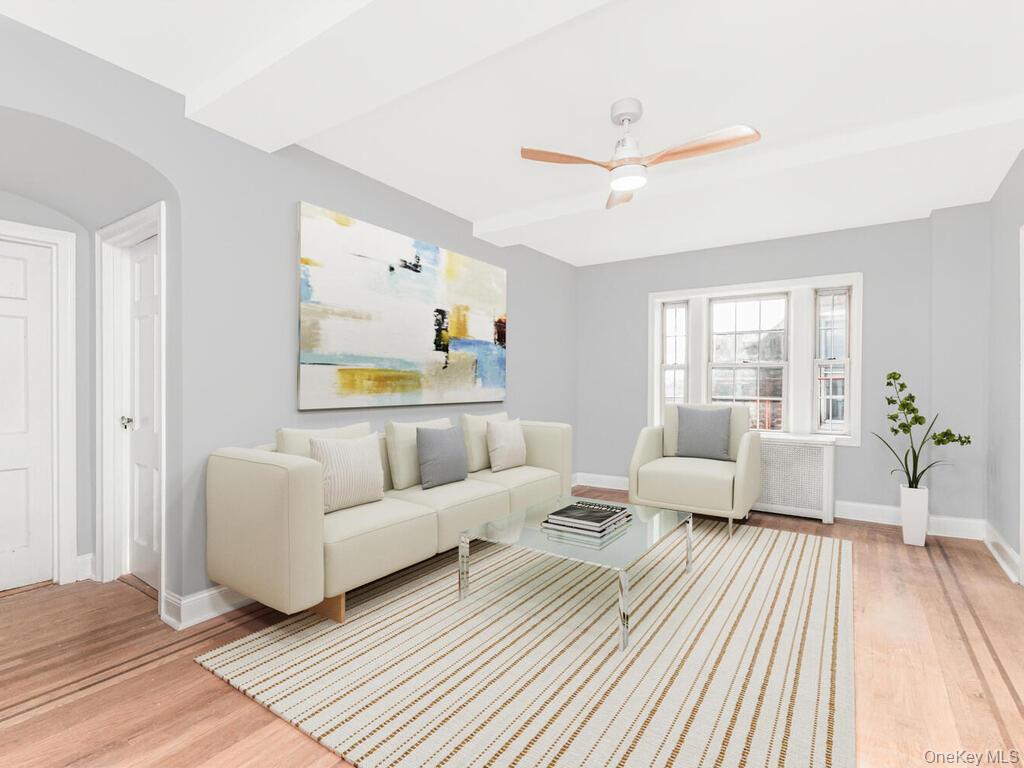 208 Centre Avenue, Unit 5K New Rochelle, NY 10805 - Photo 2 of 10 a living room with furniture and a large window