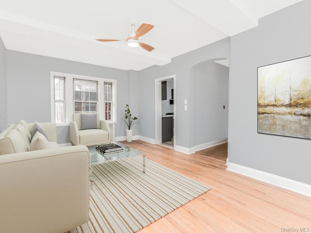 208 Centre Avenue, Unit 5K New Rochelle, NY 10805 - Photo 3 of 10 a living room with furniture and a window