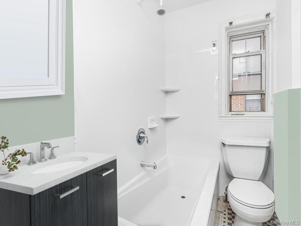 208 Centre Avenue, Unit 5K New Rochelle, NY 10805 - Photo 9 of 10 a bathroom with a sink toilet and shower