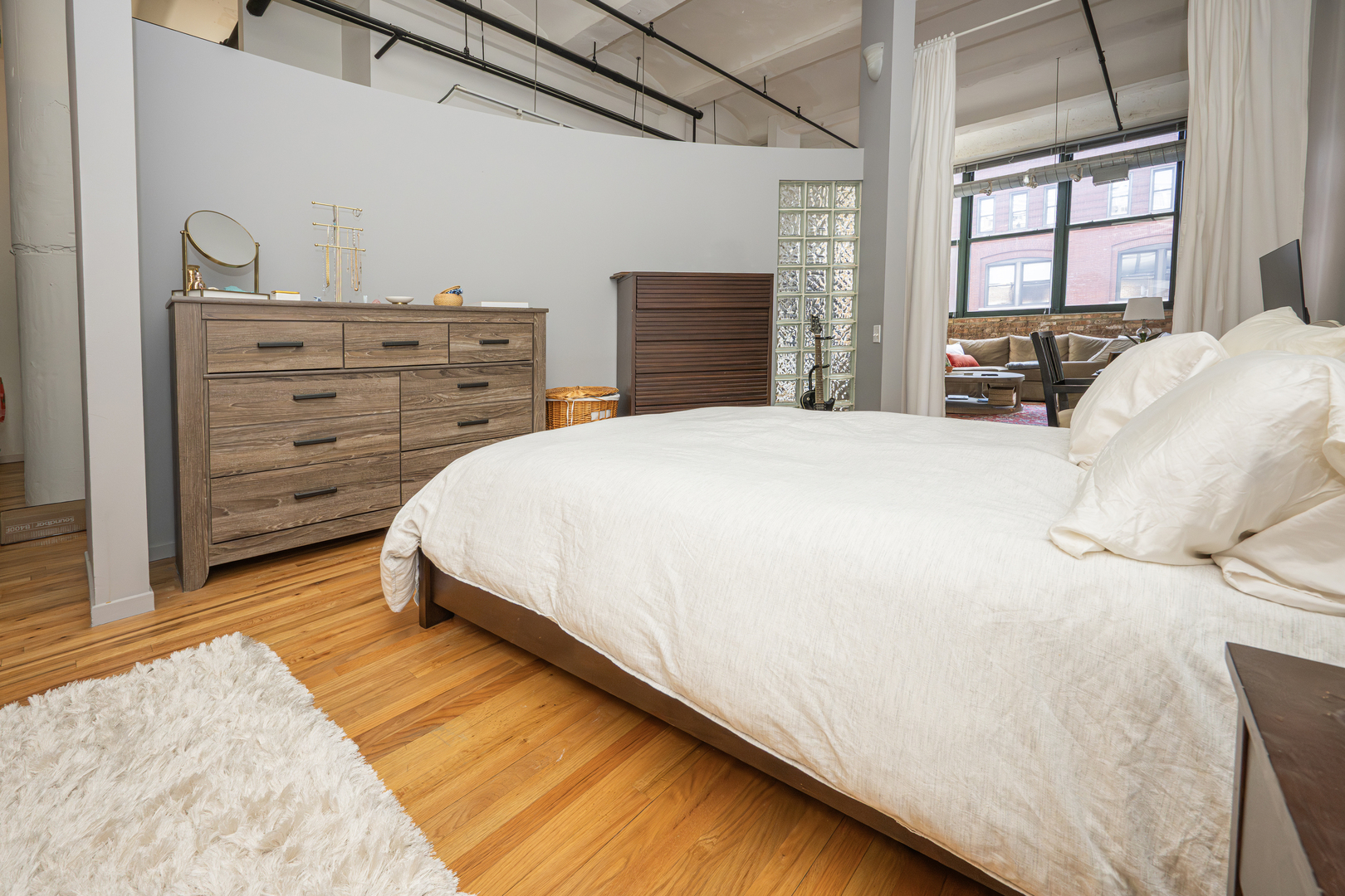 1000 West Washington Boulevard, Unit 411 Chicago, IL 60607 - Photo 13 of 20 a bedroom with a bed and a window