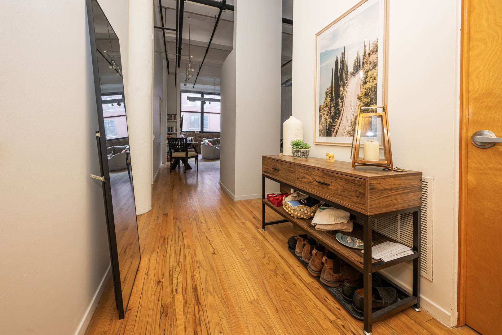 1000 West Washington Boulevard, Unit 411 Chicago, IL 60607 - Photo 10 of 20 a view of a living room with furniture and wooden floor