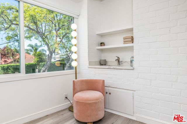 a bathroom with a toilet and a window