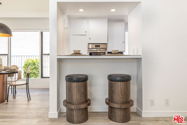 a kitchen with a table and chairs in it